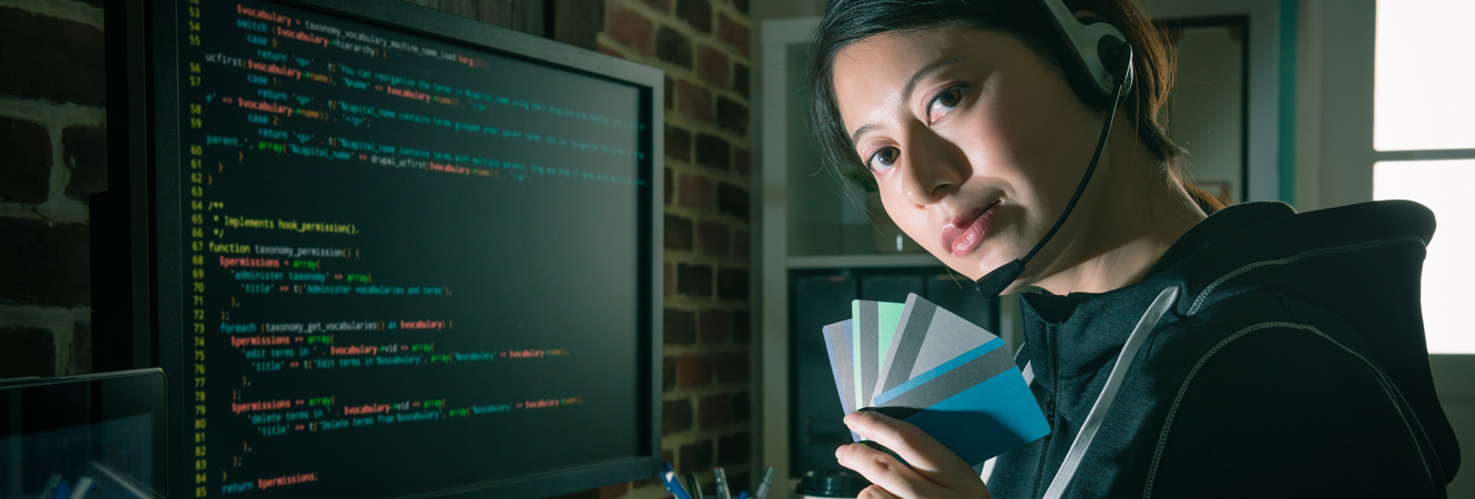 Female hacker with cards